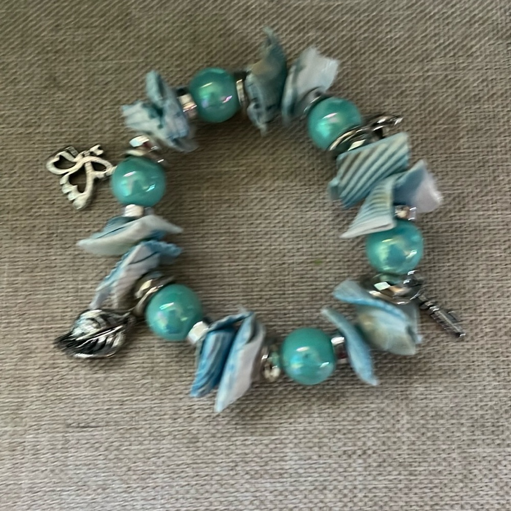 Teal charm bracelet. Cute and beachy.